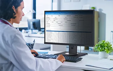 Nurse using a monitor with a built in privacy filter